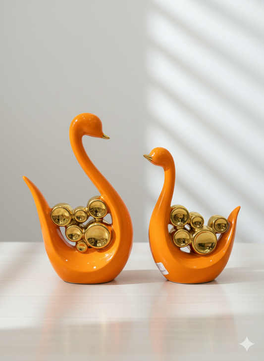 Abstract Orange Swan Figurines with Gold Accents